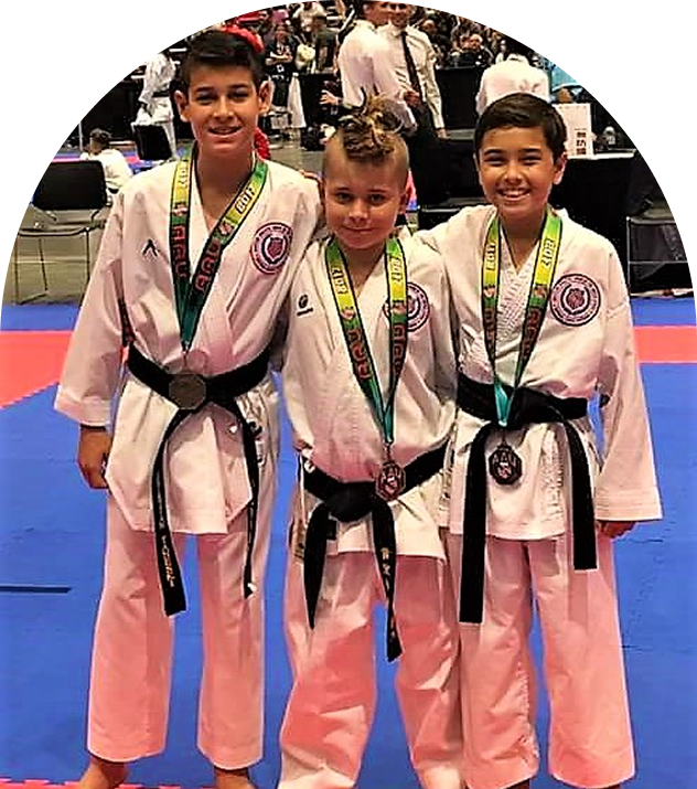 Karate kids smiling with awards