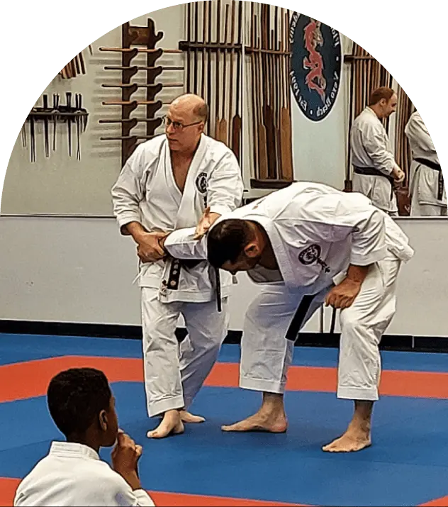 Instructor demonstrating wrist lock on partner